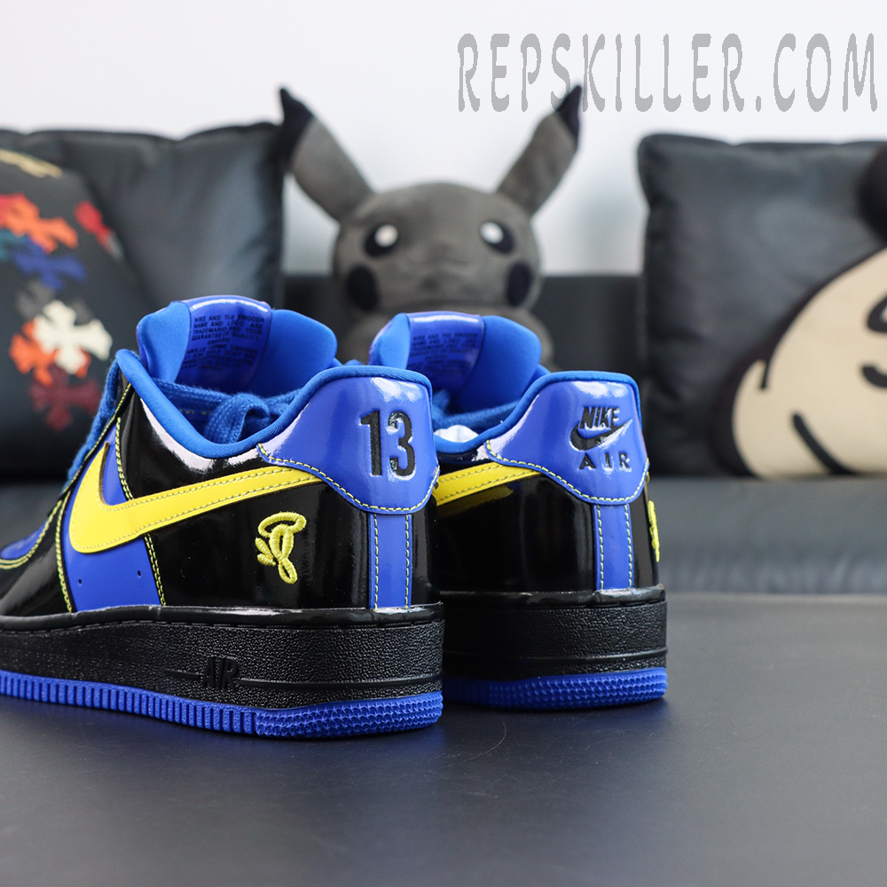 Central Cee x Nike Air Force 1 Low “Black Optic Yellow” Friends & Family rear angled detail with embroidered logo and blue outsole