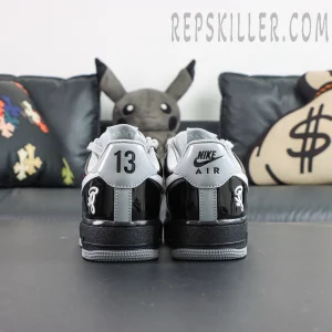 Rear view with mismatched heel branding on each shoe