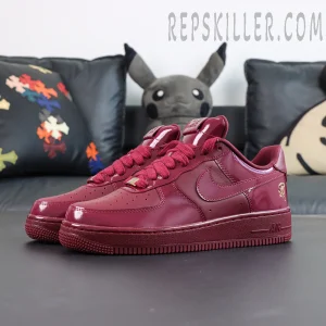 Central Cee x Nike Air Force 1 Low “Dark Beetroot” UK Exclusive angled front view with glossy burgundy upper