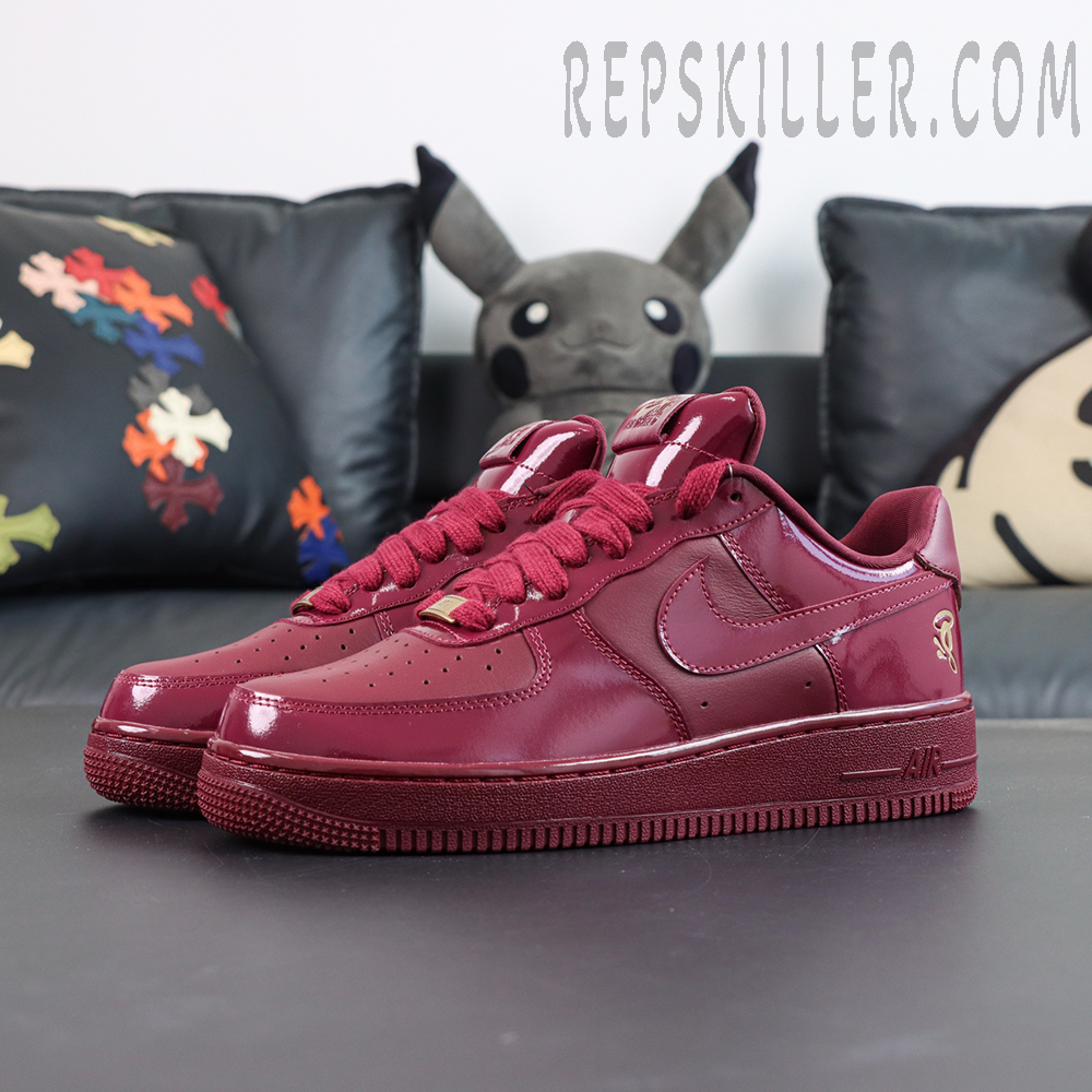 Central Cee x Nike Air Force 1 Low “Dark Beetroot” UK Exclusive angled front view with glossy burgundy upper