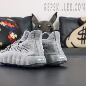 Fragment Design x Nike Mind 002 Flyknit “Particle Grey” rear angled view with grey upper and blue pod outsole accents