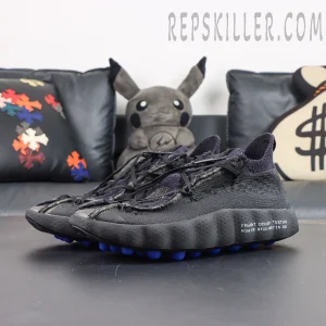 Fragment Design x Nike Mind 002 Flyknit “Black” angled front view with Flyknit woven upper and blue cushioned outsole