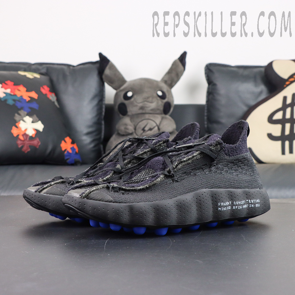Fragment Design x Nike Mind 002 Flyknit “Black” angled front view with Flyknit woven upper and blue cushioned outsole