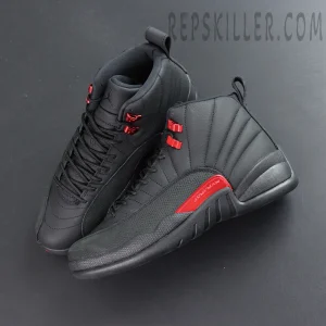 Air Jordan 12 Retro “Bloodline” top-down view highlighting red metallic eyelets and black upper details