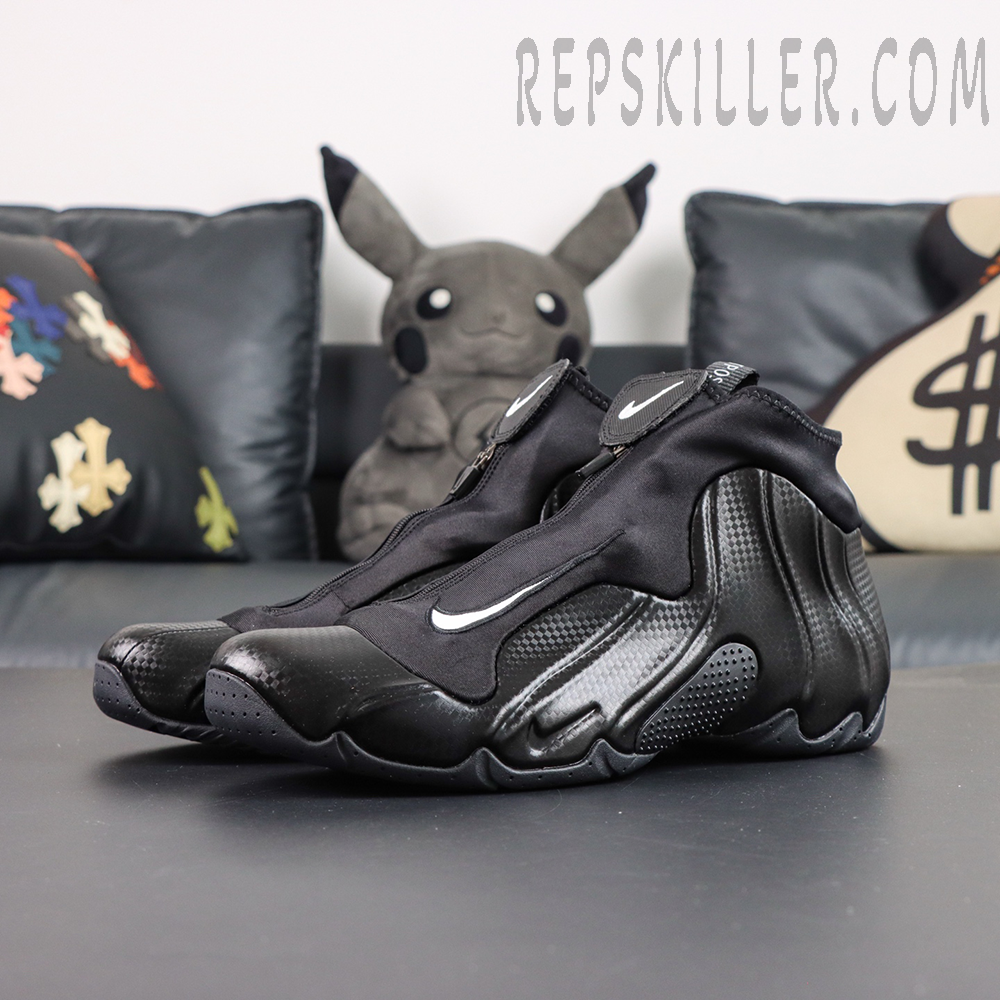Nike Air Flightposite “Carbon Fiber” pair display with all black futuristic design
