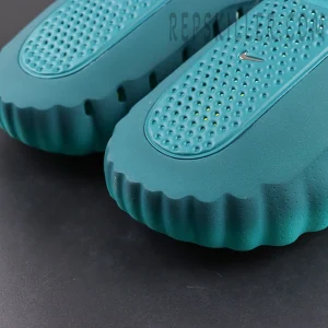 Nike Mind 001 “Geode Teal” upper detail with perforated ventilation and wavy edge design