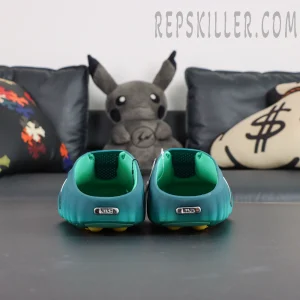 Nike Mind 001 “Geode Teal” heel view with open-back construction and metallic Nike logo detail