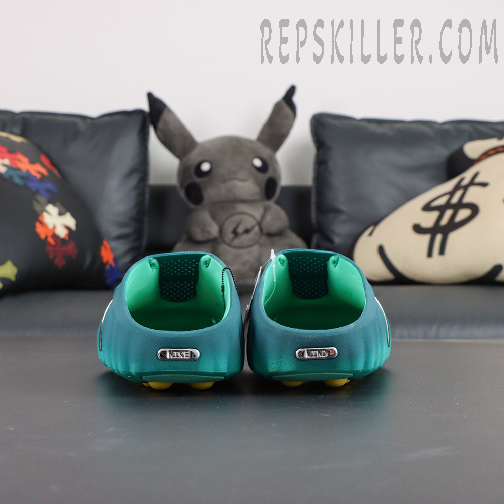 Nike Mind 001 “Geode Teal” heel view with open-back construction and metallic Nike logo detail