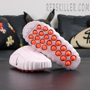 Nike Mind 001 “Pearl Pink” outsole view with bright orange independent cushioning pods