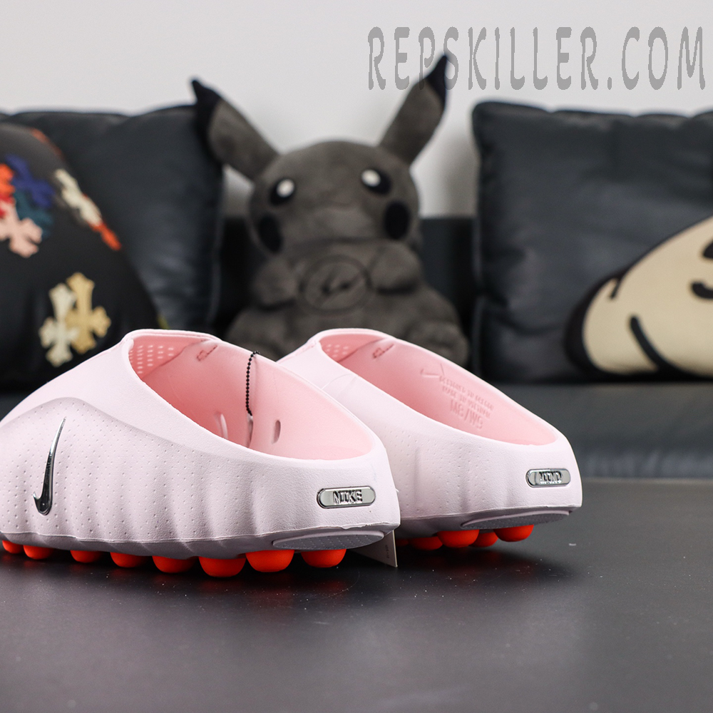 Nike Mind 001 “Pearl Pink” rear angle view with open-back entry and metallic heel badge