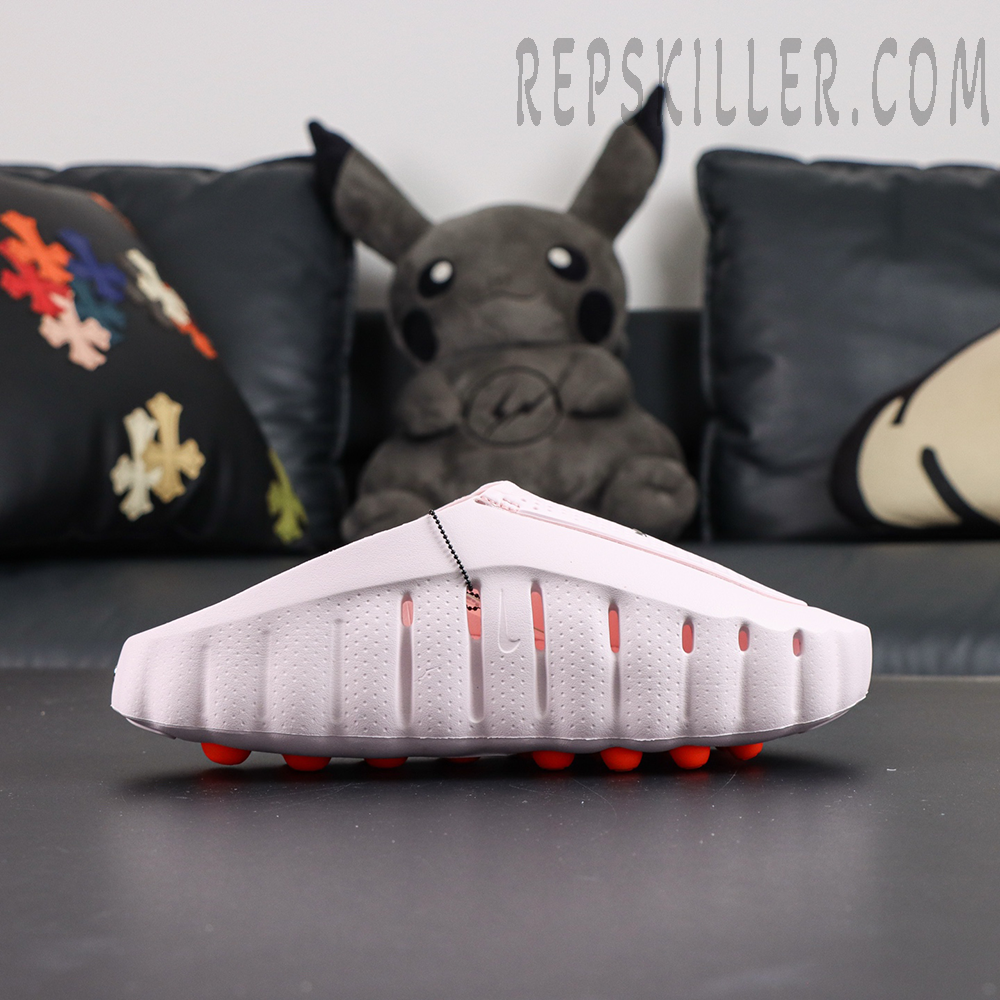 Nike Mind 001 “Pearl Pink” lateral profile with streamlined molded slip-on construction