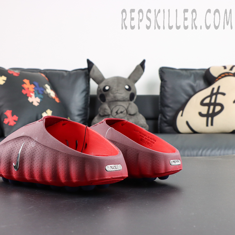 Nike Mind 001 rear side view with metallic branding and chunky sole