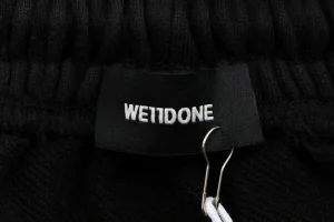 We11done Distressed Gothic Logo Shorts Brand label