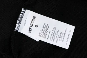 We11done Distressed Gothic Logo Shorts Wash label