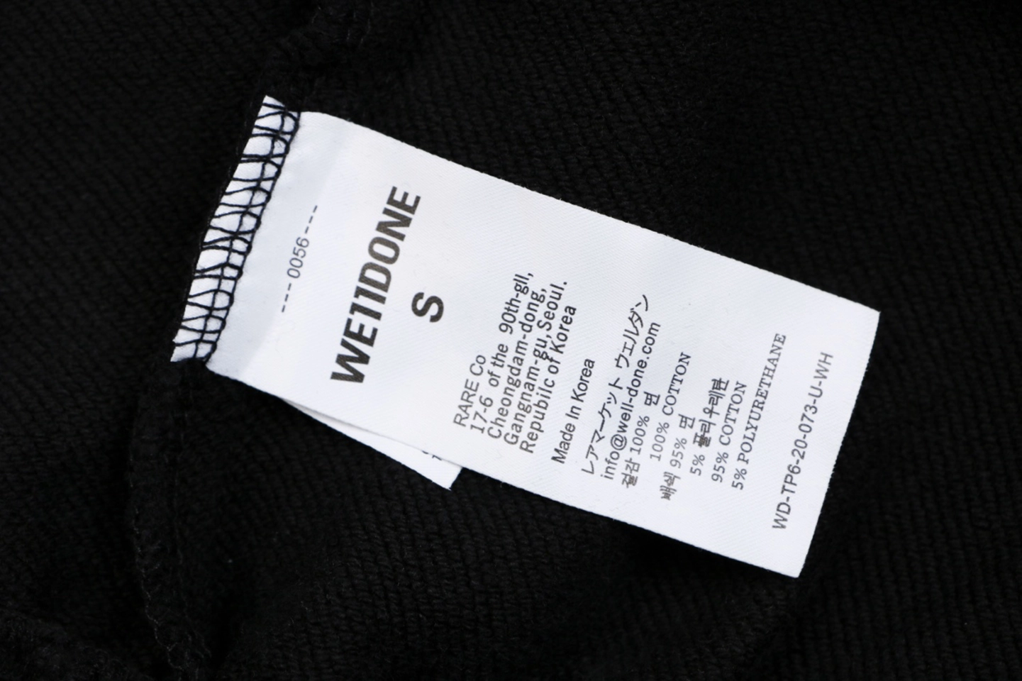We11done Distressed Gothic Logo Shorts Wash label