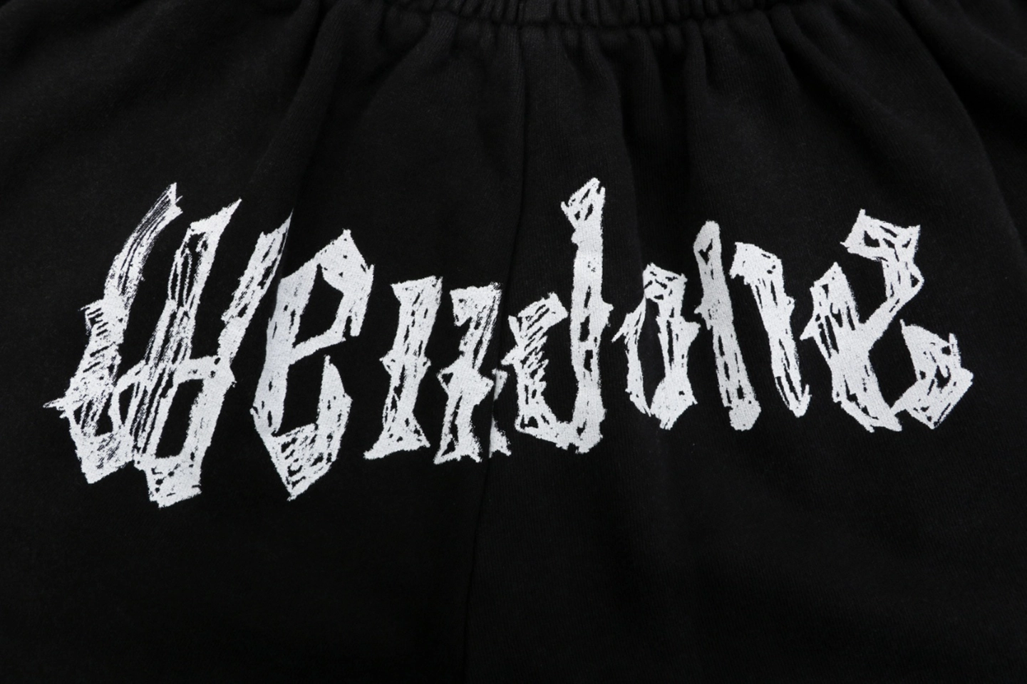 We11done Distressed Gothic Logo Shorts Front Print