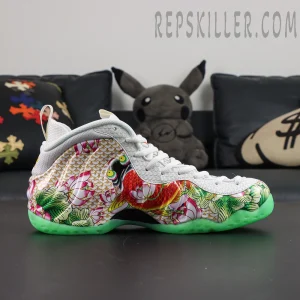 Nike Air Foamposite One Pro “Tianjin 2.0” lateral side profile featuring koi fish character artwork, lotus-inspired graphics, and glow outsole