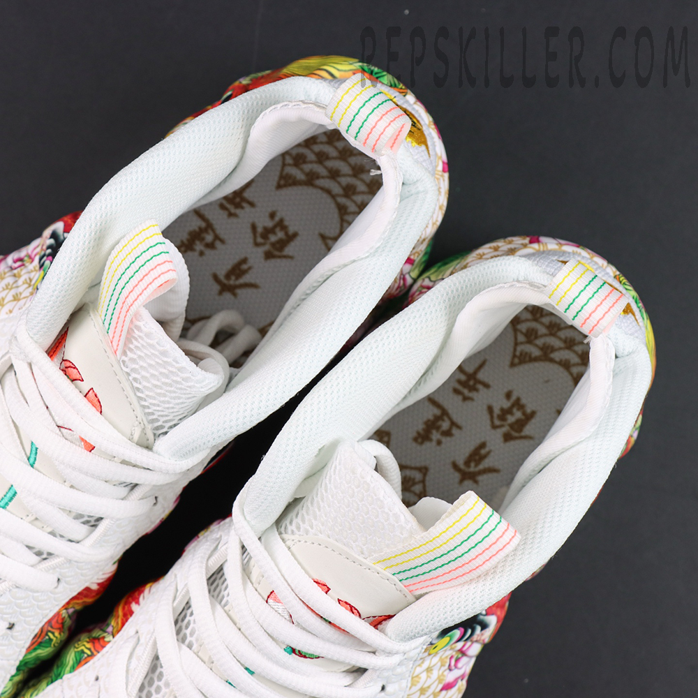 Nike Air Foamposite One Pro “Tianjin 2.0” collar and inner lining detail featuring multicolor pull tabs and Chinese-inspired graphic insoles