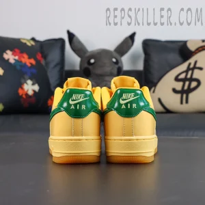 Nike Air Force 1 Low “Patent Leather Topaz Gold” heel detail featuring glossy green heel tabs with white Nike Air embroidery
