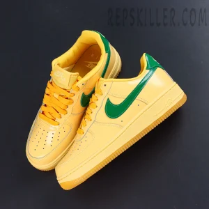 Nike Air Force 1 Low “Patent Leather Topaz Gold” top-down sneaker view featuring yellow uppers contrasted with green Swooshes
