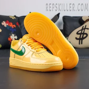 Nike Air Force 1 Low “Patent Leather Topaz Gold” outsole display featuring an orange gum rubber outsole with classic circular traction pattern