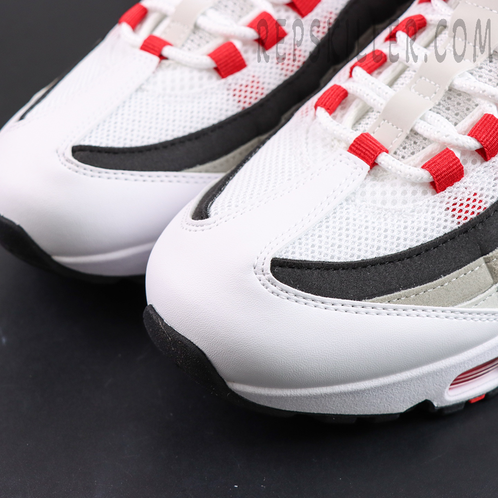 Nike Air Max 95 OG “Comet Red” toe box detail featuring white mesh upper, black and grey gradient overlays, and red lace loops