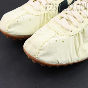 Jacquemus x Nike Moon Shoe SP “Alabaster” toe box detail featuring lightweight nylon construction with suede overlays