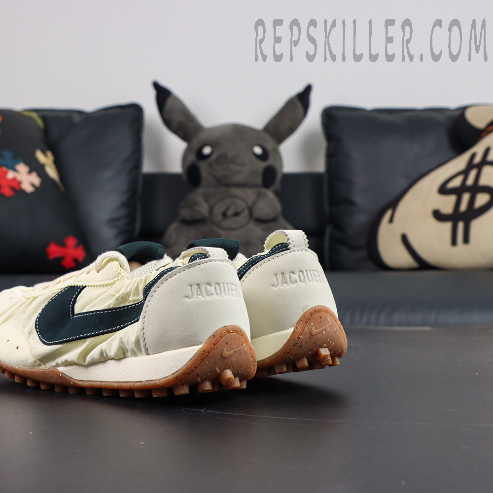Jacquemus x Nike Moon Shoe SP “Alabaster” rear angled view featuring cream upper, dark Swoosh, and brown studded outsole