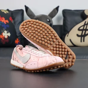 Jacquemus x Nike Moon Shoe SP “Aluminum Pink” outsole view featuring iconic waffle traction and vintage-inspired running shoe details