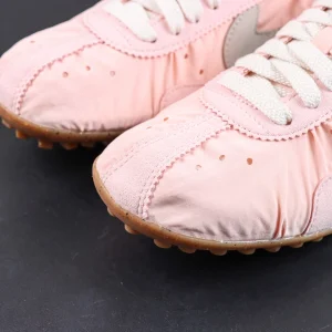Jacquemus x Nike Moon Shoe SP “Aluminum Pink” toe box detail featuring suede overlays and perforated accents for a vintage-inspired aesthetic