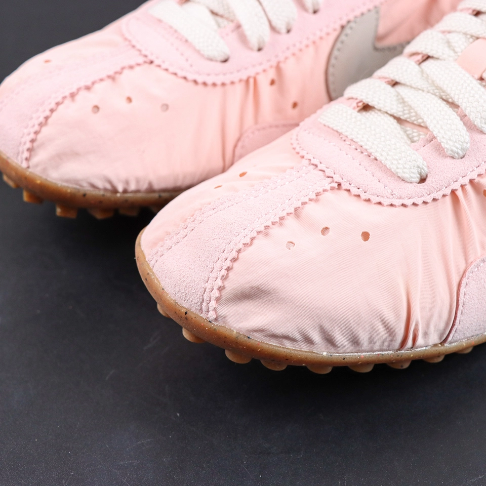 Jacquemus x Nike Moon Shoe SP “Aluminum Pink” toe box detail featuring suede overlays and perforated accents for a vintage-inspired aesthetic