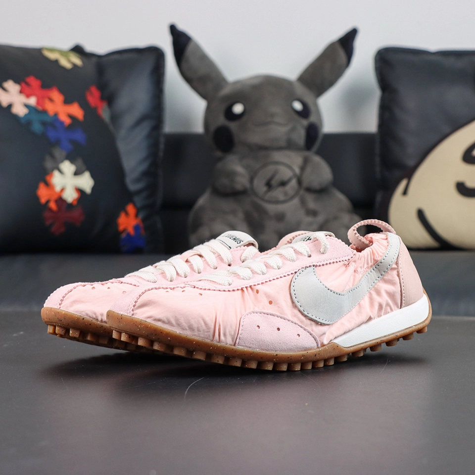Jacquemus x Nike Moon Shoe SP “Aluminum Pink” pair display featuring a soft pink upper combined with a classic waffle outsole for a retro sporty aesthetic