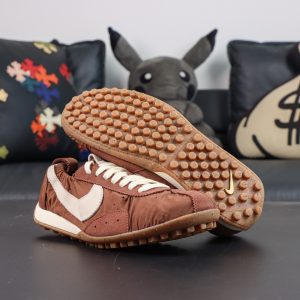 Jacquemus x Nike Moon Shoe SP “Fauna Brown” showcasing the classic waffle outsole and vintage-inspired running silhouette