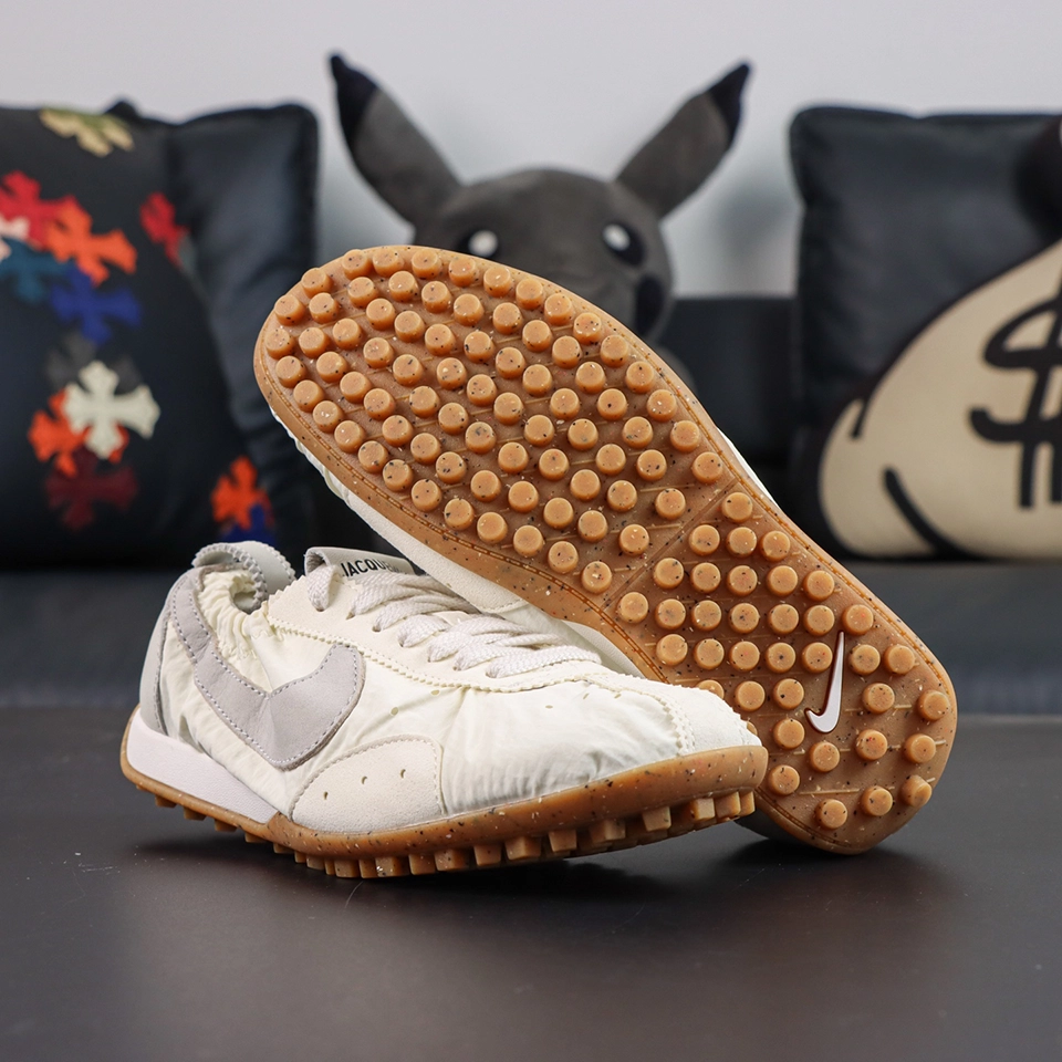 Jacquemus x Nike Moon Shoe SP “Soft Pearl” outsole view featuring classic waffle traction and vintage-inspired running design elements