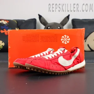 Jacquemus x Nike Moon Shoe SP “University Red” displayed with shoebox featuring bright red upper and off-white Swoosh