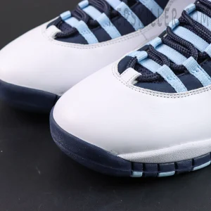 Air Jordan 10 Retro “Ice Blue” toe box close-up featuring white leather uppers with navy outsole accents and ice blue lace loops