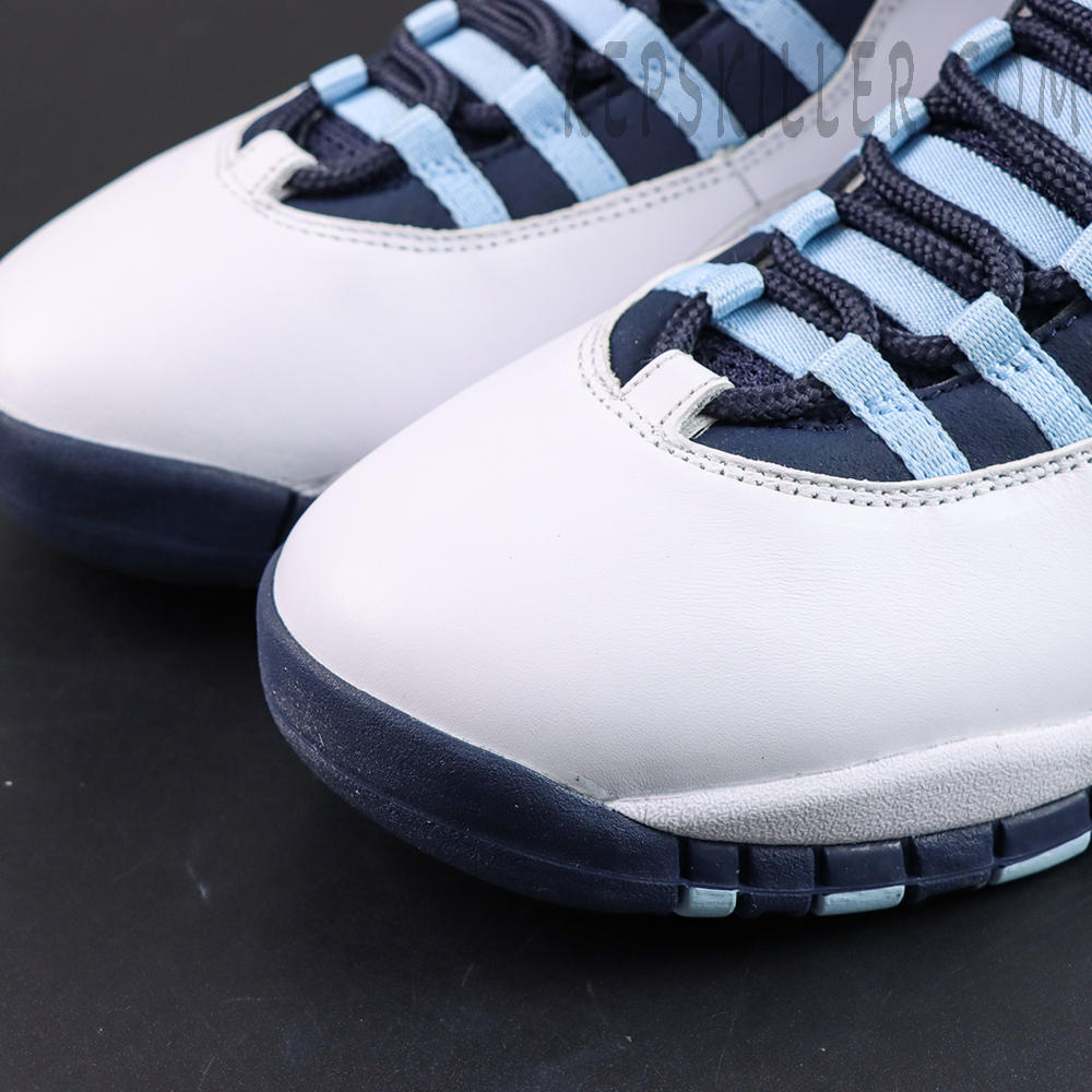Air Jordan 10 Retro “Ice Blue” toe box close-up featuring white leather uppers with navy outsole accents and ice blue lace loops