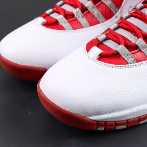 Air Jordan 10 Retro “Red Steel” toe box close-up featuring smooth white leather with red outsole and grey lace straps