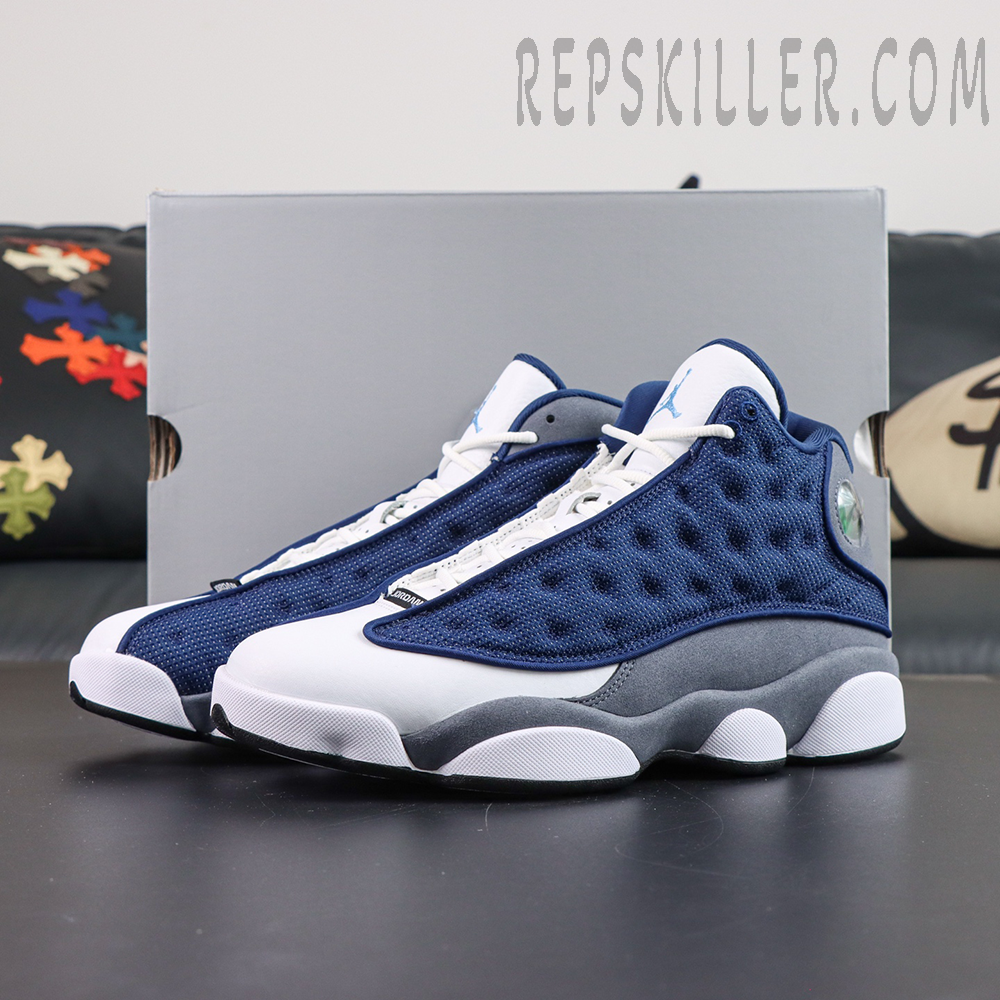 Air Jordan 13 Retro “Flint” display with shoe box featuring the classic basketball silhouette and reflective navy upper panels