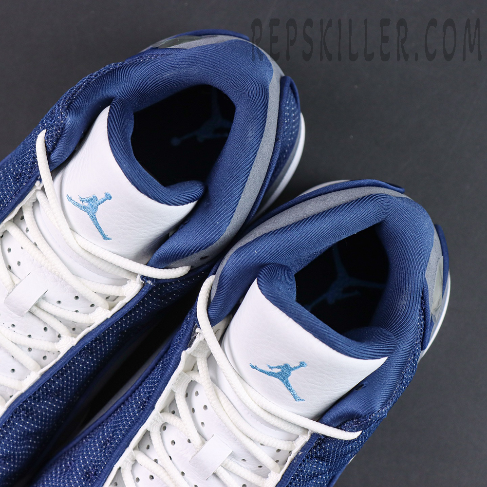 Air Jordan 13 Retro “Flint” collar and tongue detail featuring navy lining and light blue embroidered Jumpman logos