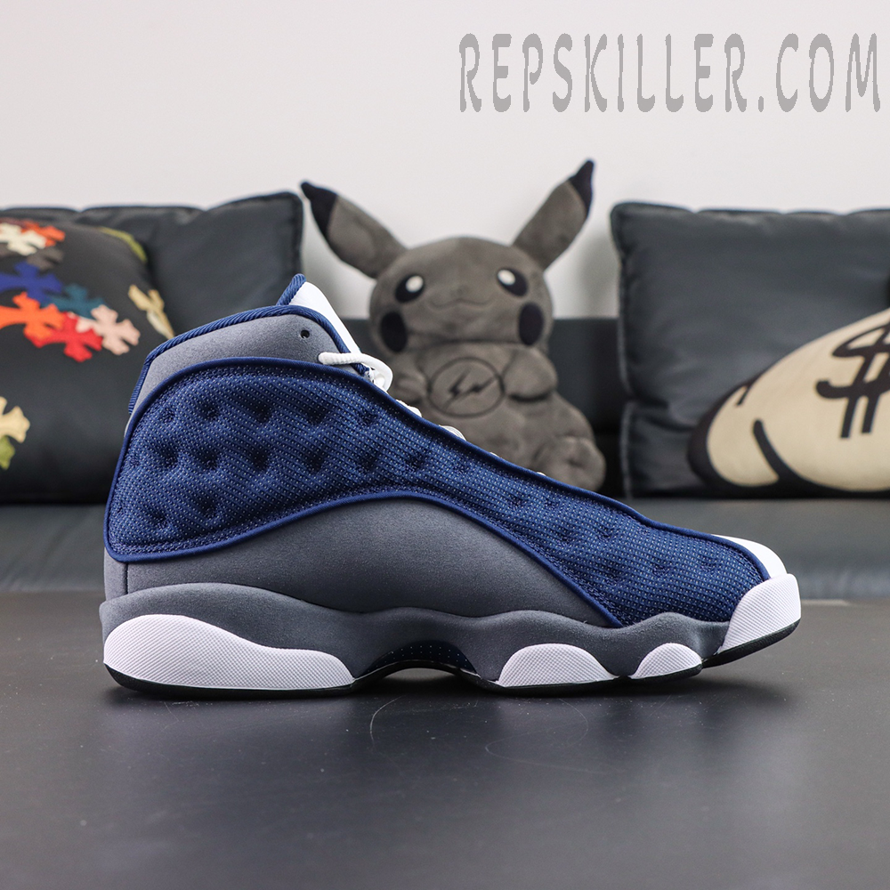 Air Jordan 13 Retro “Flint” side profile showcasing the signature holographic eye detail and sculpted midsole design