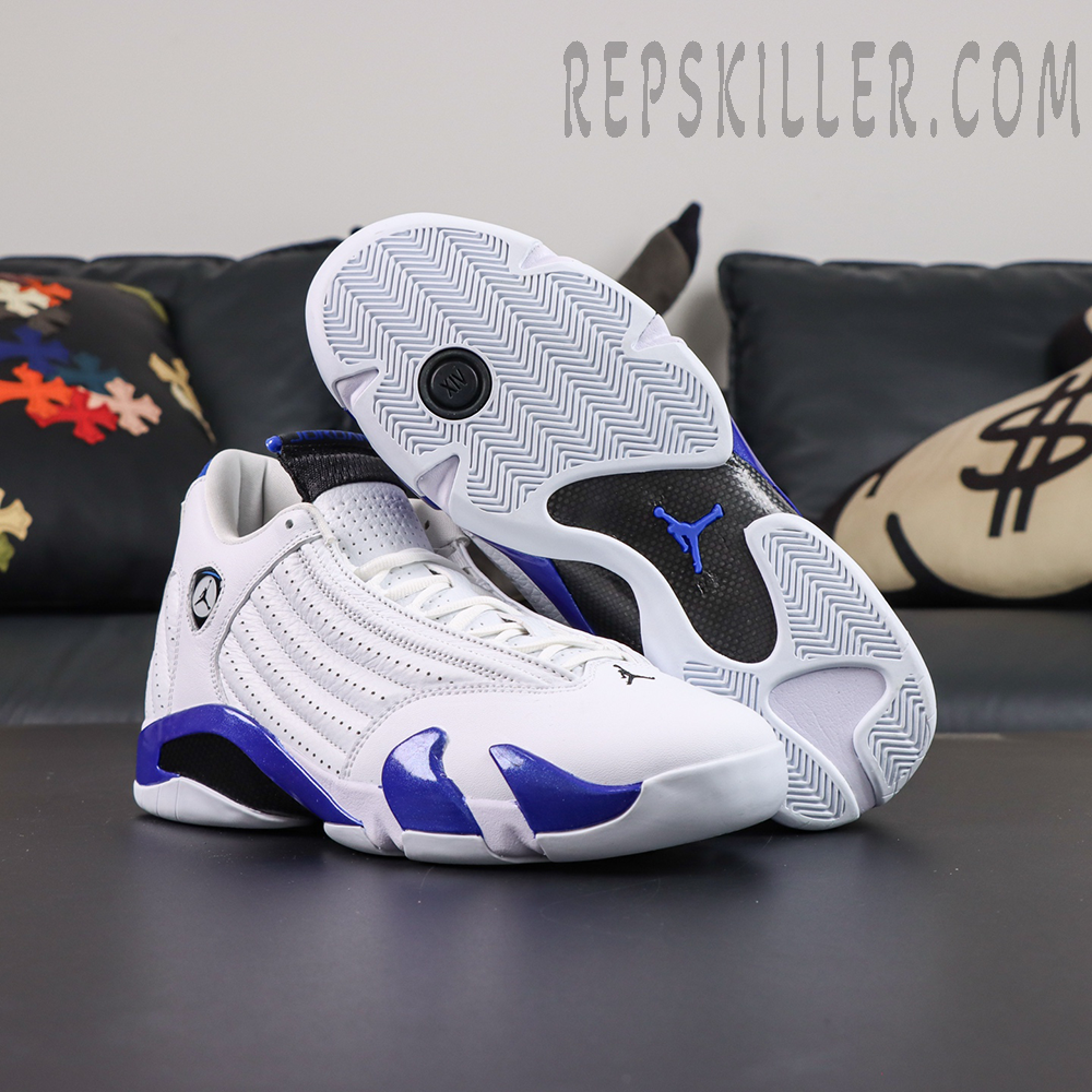 Air Jordan 14 Retro “Hyper Royal” outsole display featuring white herringbone traction, carbon fiber detailing, and a blue Jumpman logo