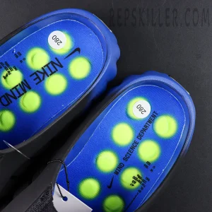 Nike Mind 001 Flyknit “Hyper Royal” insole detail featuring a blue footbed with neon green pod graphics and Nike branding