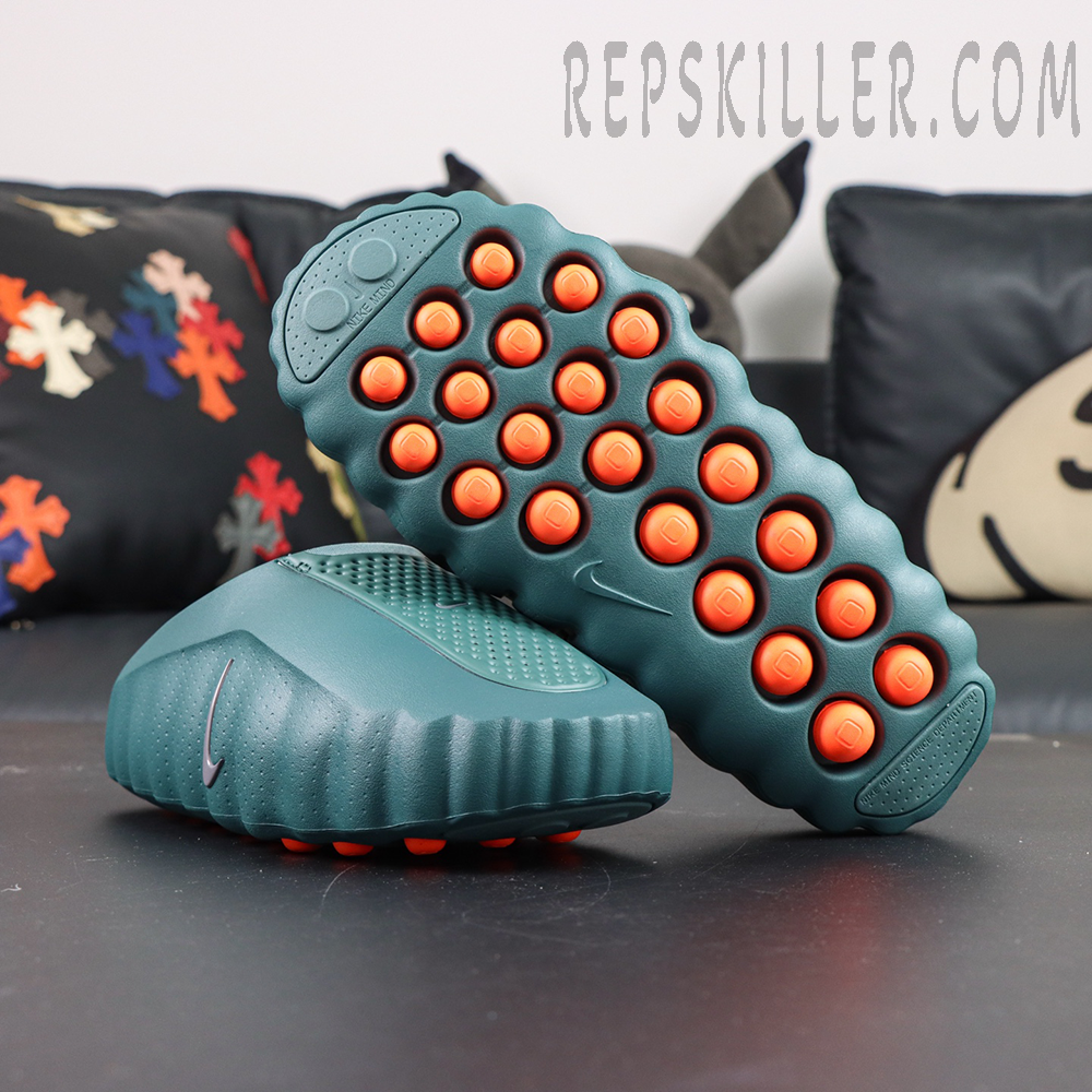 Nike Mind 001 “Mineral Slate” outsole view featuring bright orange independent cushioning pods for a futuristic aesthetic