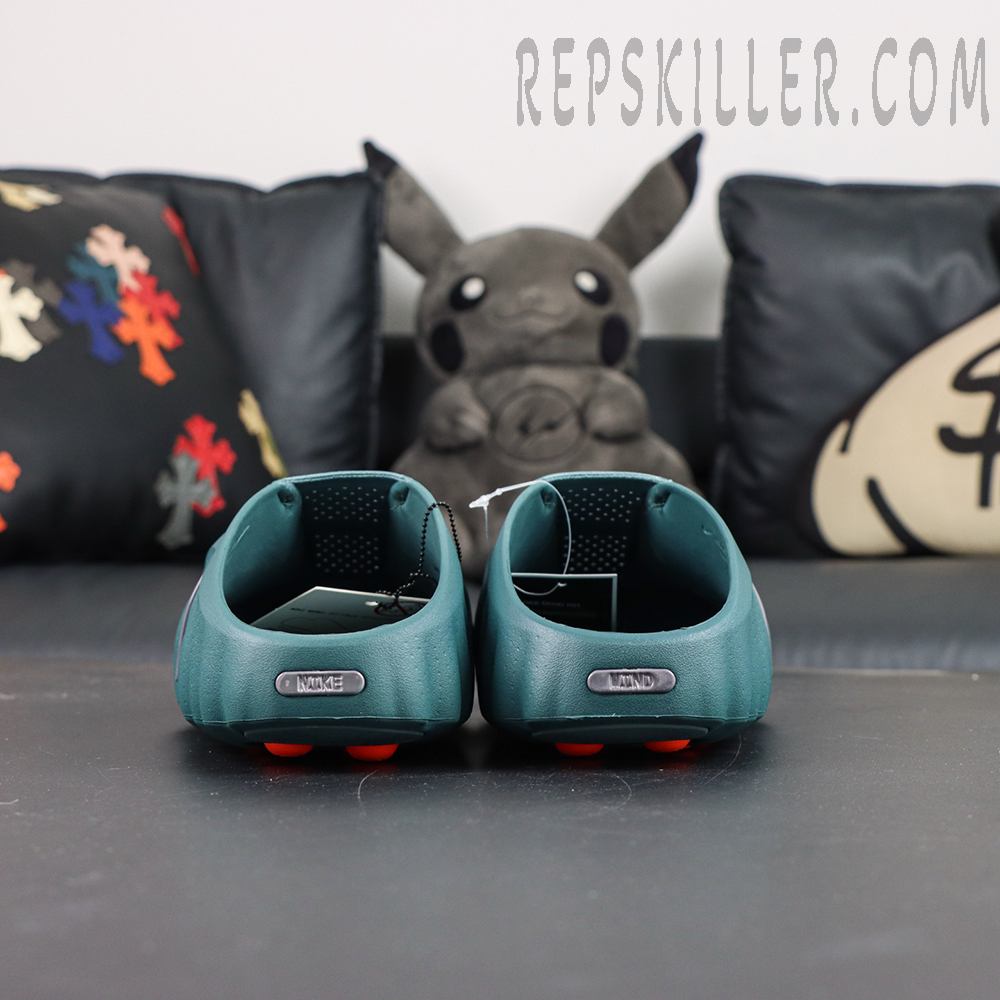Nike Mind 001 “Mineral Slate” heel view showcasing minimalist heel construction with metallic Nike and Mind branding