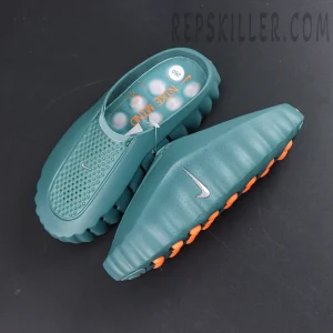 Nike Mind 001 “Mineral Slate” top-down view featuring the futuristic mule silhouette with orange outsole cushioning pods