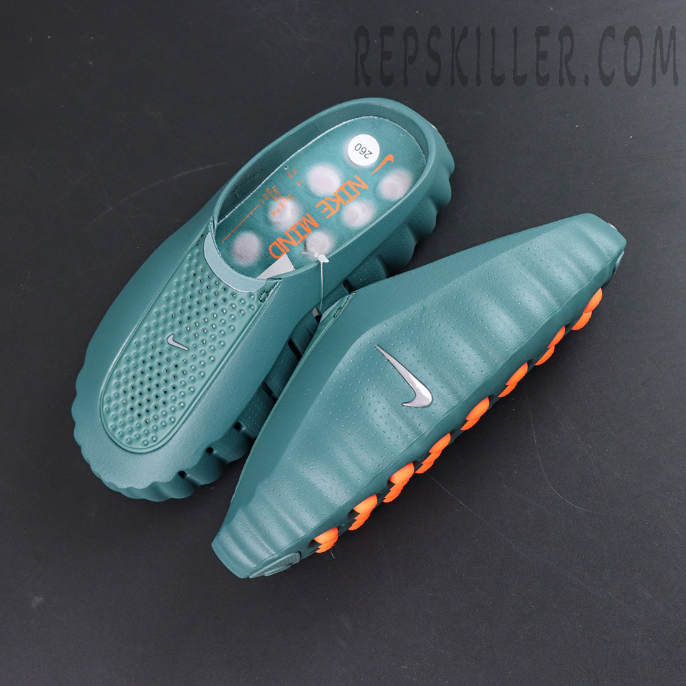 Nike Mind 001 “Mineral Slate” top-down view featuring the futuristic mule silhouette with orange outsole cushioning pods