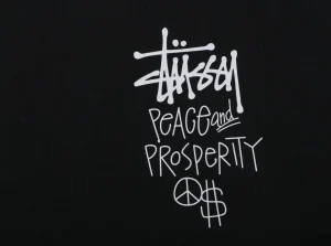 Stussy Peace & Prosperity Doll Graphic T-Shirt Black Back Print