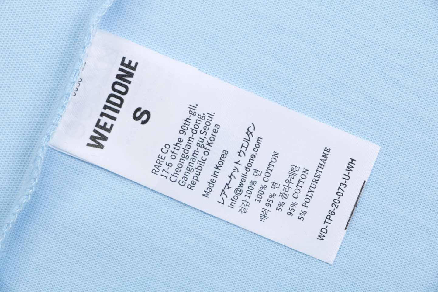 We11done Letter Outline Bear Graphic T-Shirt Blue Wash label