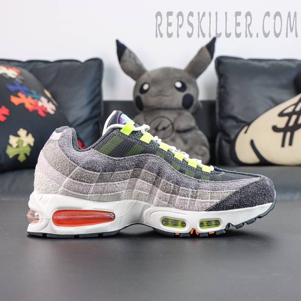 Nike Air Max 95 OG ‘Greedy/What The’ side profile showcasing the iconic layered wave design with grey tones and colorful accents